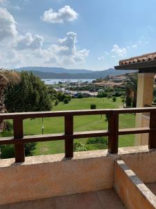 a view of a golf course from the balcony of a house at La Banchina Residence in Cannigione