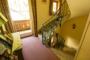 a hallway with a spiral staircase in a home at Haus Josef in Mayrhofen