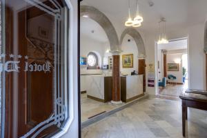 two views of a kitchen and a living room at Hotel du Lac Varenna in Varenna