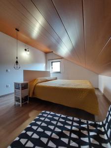 מיטה או מיטות בחדר ב-Miradouros da Aldeia