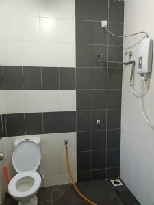 a bathroom with a shower with a toilet in it at Azzalea Homes 1 @ Taman Golden Hills Cameron Highlands in Brinchang +15 photos