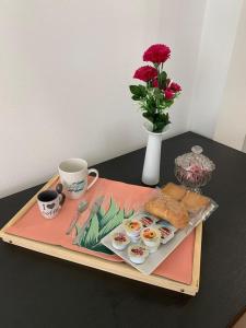 a tray with eggs and sandwiches and a cup of coffee at La Casa di Allegra, Monolocale a Le Grazie - Comune di Portovenere in Portovenere
