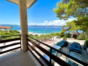 a balcony with a view of the ocean at Villa Slatine apartment in Slatine