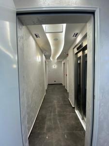 a hallway of an office building with a ceiling at Marinus Hotel in Ulcinj