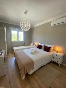 Ένα ή περισσότερα κρεβάτια σε δωμάτιο στο Quinta Janelas do Vale