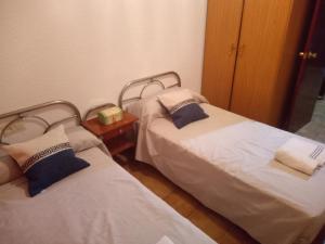 Een bed of bedden in een kamer bij Miguel y Rosa Lúcar