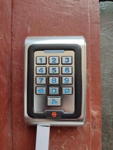 a close up of a remote control on a wall at Downtown Studio in Oradea