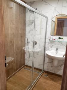 a bathroom with a shower and a sink at Lovely Borovets Apartment in Borovets