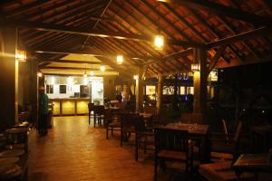 a dining room with tables and chairs in a restaurant at Blue Beach Hotel in Wadduwa