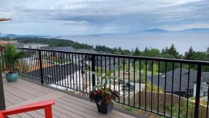a balcony with a view of the water at 风语海景 in Nanaimo