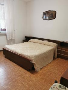 Postel nebo postele na pokoji v ubytování CasAngelica Alloggio indipendente con parcheggio interno