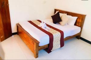 Voodi või voodid majutusasutuse Trinco Relax Hut toas