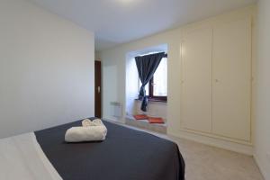 Letto o letti in una camera di Osteria Pozzo