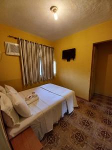 Cama ou camas em um quarto em Pousada Klein