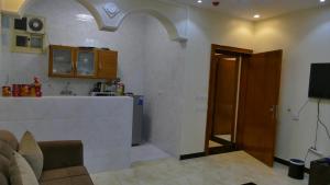 a living room with a counter and a kitchen at ABHASKY in Abha