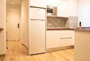 Kuchyňa alebo kuchynka v ubytovaní Apartamentos Leonor