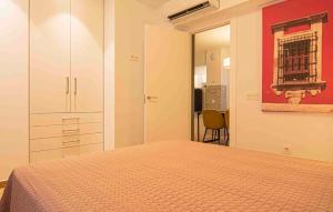Posteľ alebo postele v izbe v ubytovaní Apartamentos Leonor