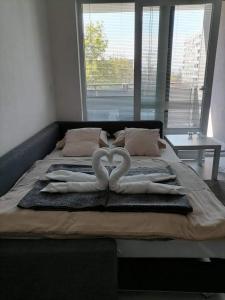 A bed or beds in a room at Apartmán U Parku