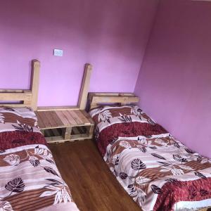 Postelja oz. postelje v sobi nastanitve Guest House Gvidani