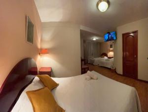 Letto o letti in una camera di Hotel Vilandre