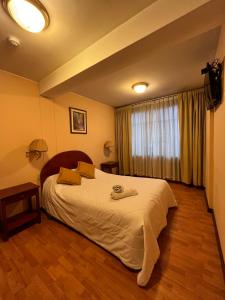 Letto o letti in una camera di Hotel Vilandre