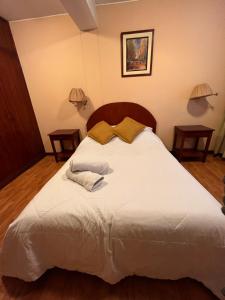Letto o letti in una camera di Hotel Vilandre