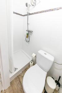 a white bathroom with a toilet and a shower at Premium City Apartment in Center of Vienna in Vienna