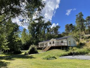 a house on the side of a hill at Stockholm archipelago with boat and bikes in Djurhamn