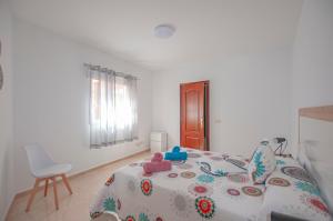 Posteľ alebo postele v izbe v ubytovaní Apartamento Cruz de Toledo