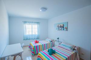Posteľ alebo postele v izbe v ubytovaní Apartamento Cruz de Toledo