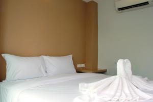 Ένα ή περισσότερα κρεβάτια σε δωμάτιο στο Cheeky Monkey's Samui