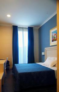 Postel nebo postele na pokoji v ubytování Hotel Palazzo Giancola