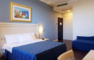 Postel nebo postele na pokoji v ubytování Hotel Palazzo Giancola