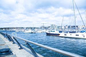 a group of boats docked in a marina at A luxury 2 bedroom apartment with 2 free parking in Chatham