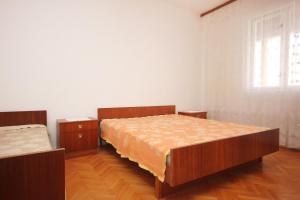 Postel nebo postele na pokoji v ubytování Apartments with a parking space Povljana, Pag - 9405