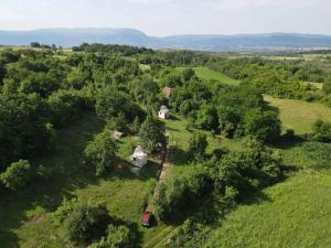 an aerial view of a house in a field with trees at Rtanj,Vrmdza,,Hotel sa hiljadu zvezdica" in Soko Banja