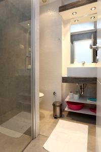 a bathroom with a shower and a sink at Apartments by the sea Duce, Omis - 10304 in Duće