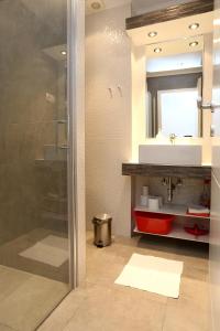 a bathroom with a sink and a shower at Apartments by the sea Duce, Omis - 10304 in Duće
