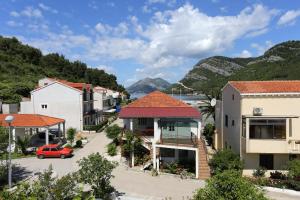 a view of a town with mountains in the background at Apartments by the sea Zuljana, Peljesac - 10112 in Žuljana
