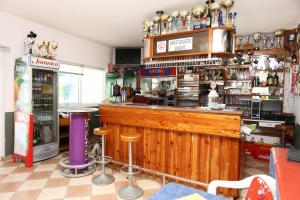 a bar with a wooden counter in a room at Apartments by the sea Zuljana, Peljesac - 10218 in Žuljana