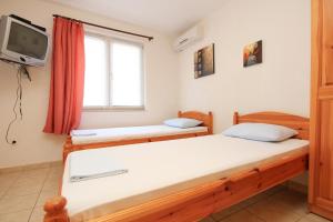 Postel nebo postele na pokoji v ubytování Apartments and rooms with parking space Orebic, Peljesac - 10191