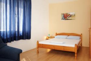Postel nebo postele na pokoji v ubytování Apartments and rooms with parking space Orebic, Peljesac - 10191