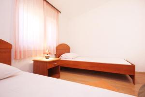 Posteľ alebo postele v izbe v ubytovaní Apartments with parking spaces Orebic, Peljesac - 10075