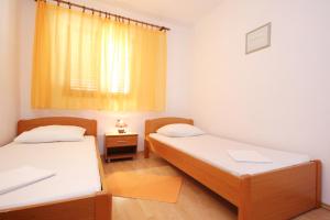 Posteľ alebo postele v izbe v ubytovaní Apartments with parking spaces Orebic, Peljesac - 10075