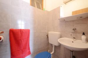 a bathroom with a toilet and a sink at Apartment Prizba 10063c in Prizba