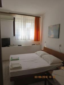 Ένα ή περισσότερα κρεβάτια σε δωμάτιο στο Studio Drace 10135a