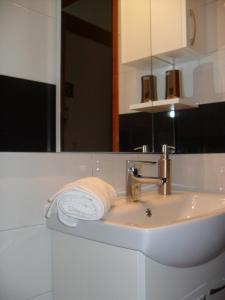 a bathroom sink with a towel and a mirror at Studio Orebic 10256b in Orebić +17 photos