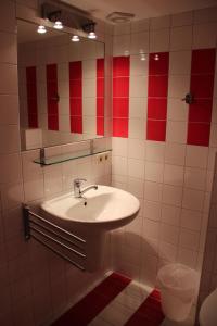 a bathroom with a sink and a mirror at The Pirklalm in Pruggern