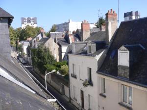 an overhead view of a city with houses and roofs at Studio calme au coeur de Tours in Tours