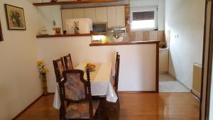 a kitchen with a table and chairs in a room at Apartments with WiFi Split - 11680 in Split